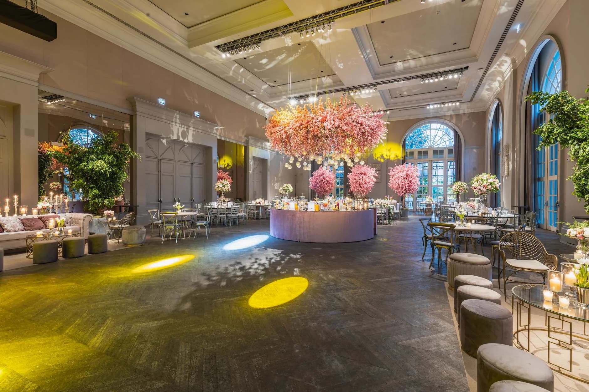 Limestone estate ballroom set for a wedding reception with ambient lighting